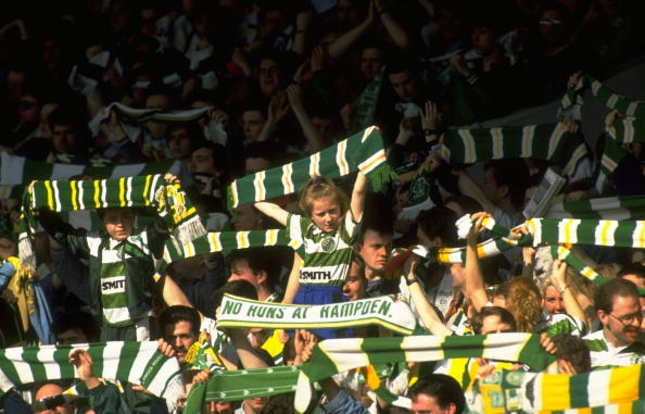 24 Mar 1991:  Celtic supporters wave their scarves in support of their team during the Scottish Premier League match against Rangers at Celtic Park...