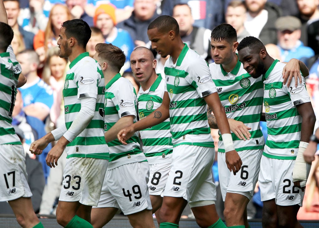 Celtic players celebrate at Ibrox