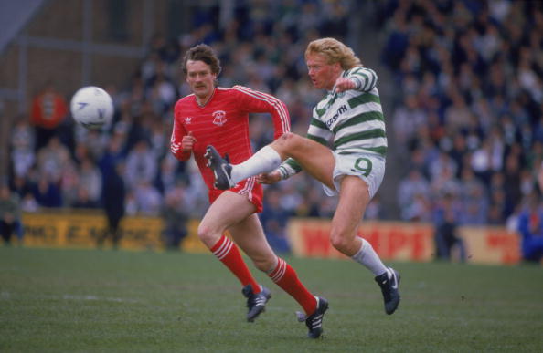 Scottish footballer Mo Johnston of Celtic F.C is watched by Bell of Aberdeen during a Scottish Premier League match against Aberdeen F.C. at Pittod...