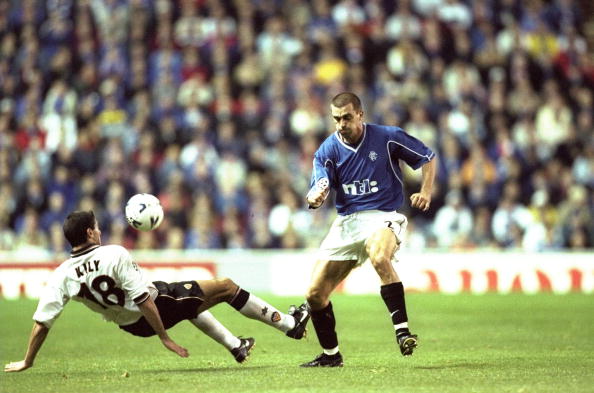 26 Oct 1999: Sergio Porrini of Rangers is tackled by Kily Gonzalez of Valencia during the Champions League match played at Ibrox Stadium in Glasgo...
