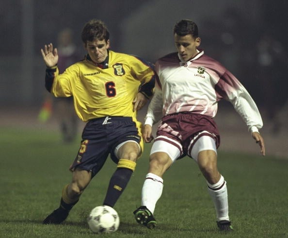 5 Oct 1996:  Tosh McKinlay of Scotland (left) challenges Imants Bleidelis of Latvia for the ball during the World cup qualifier between Latvia and ...