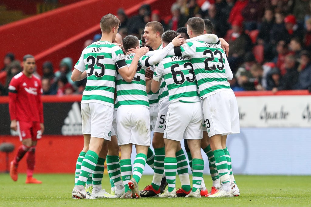Celtic players celebrate at Pittodrie