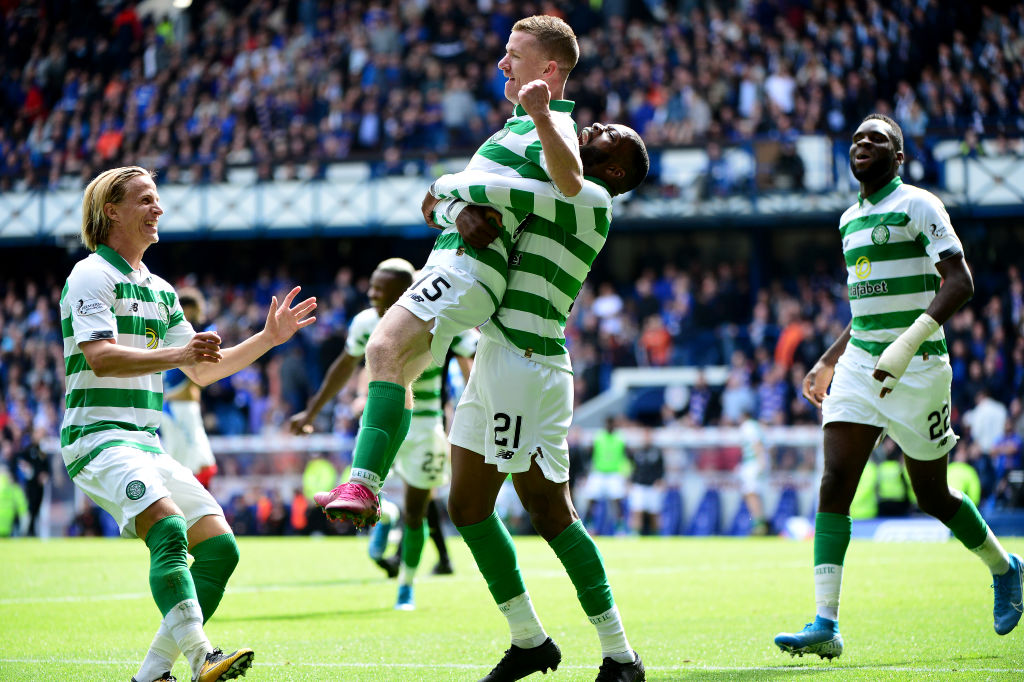 Celtic players celebrate at Ibrox