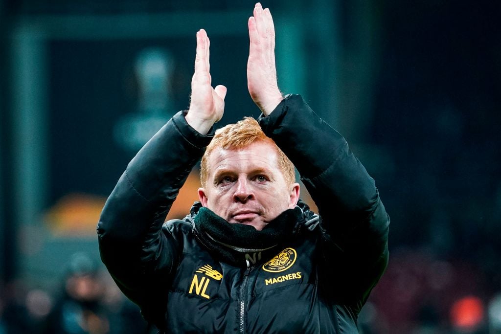 Neil Lennon applauds the supporters