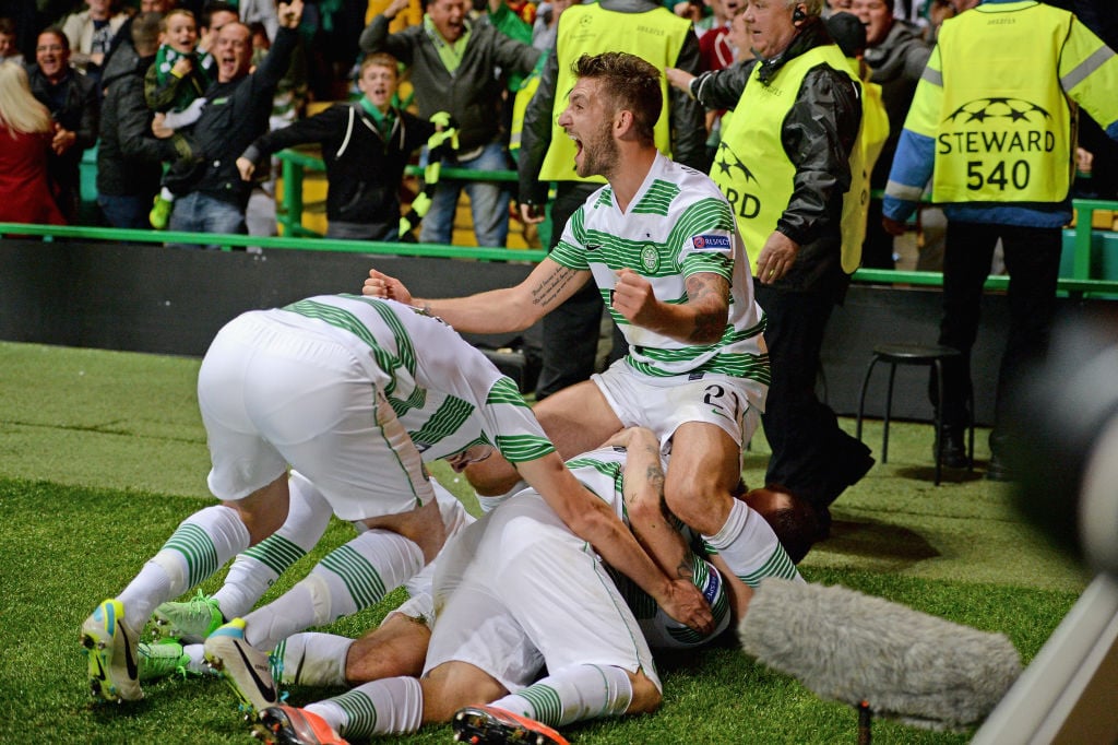 The Celtic players celebrate Forrest's winner