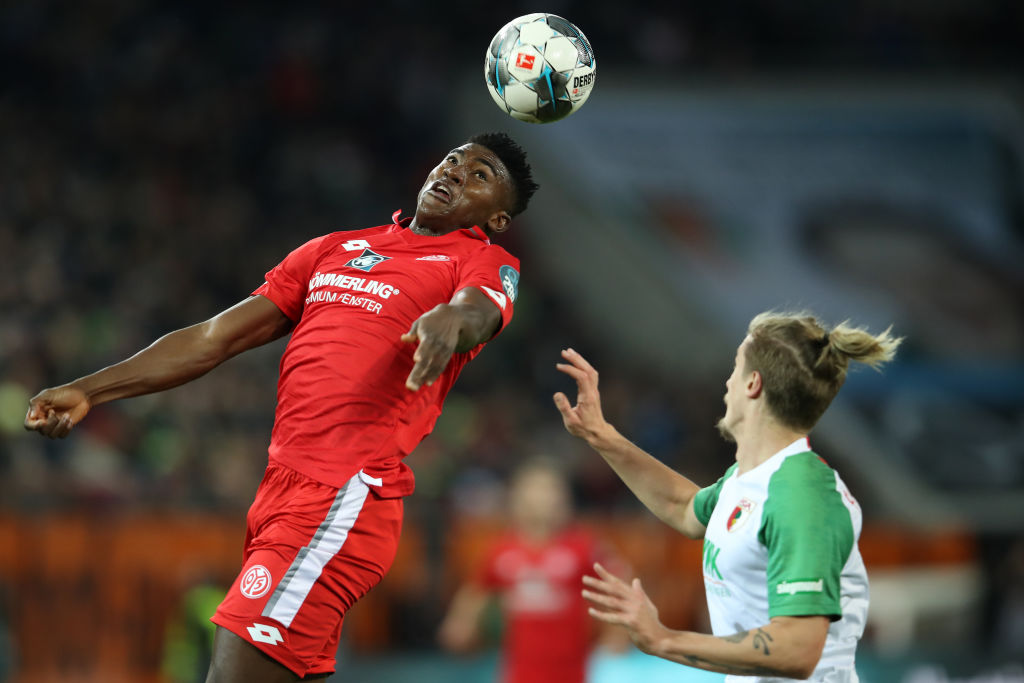 Taiwo Awoniyi challenges for the ball