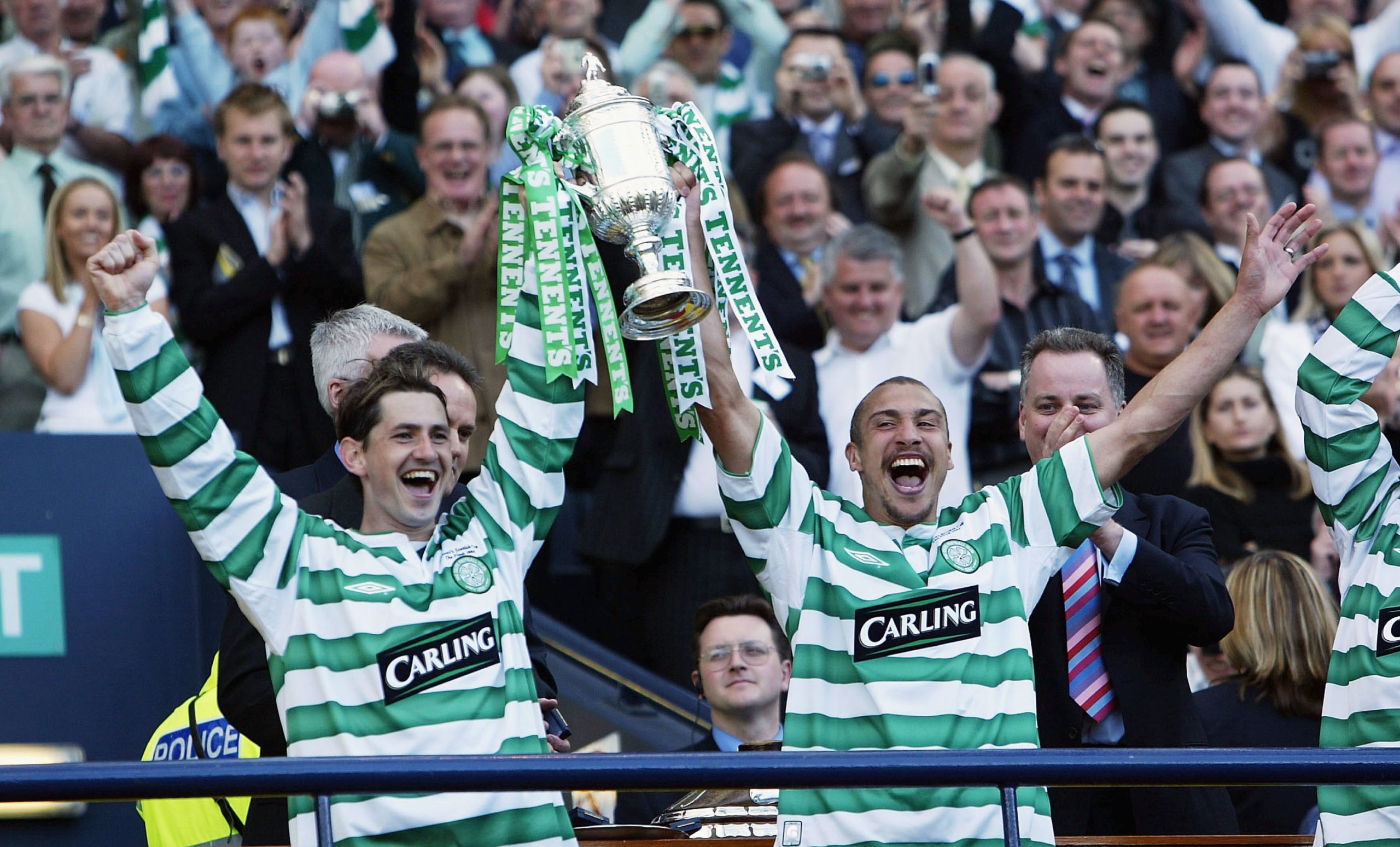 Jackie McNamara and Henrik Larsson celebrate a Celtic trophy win