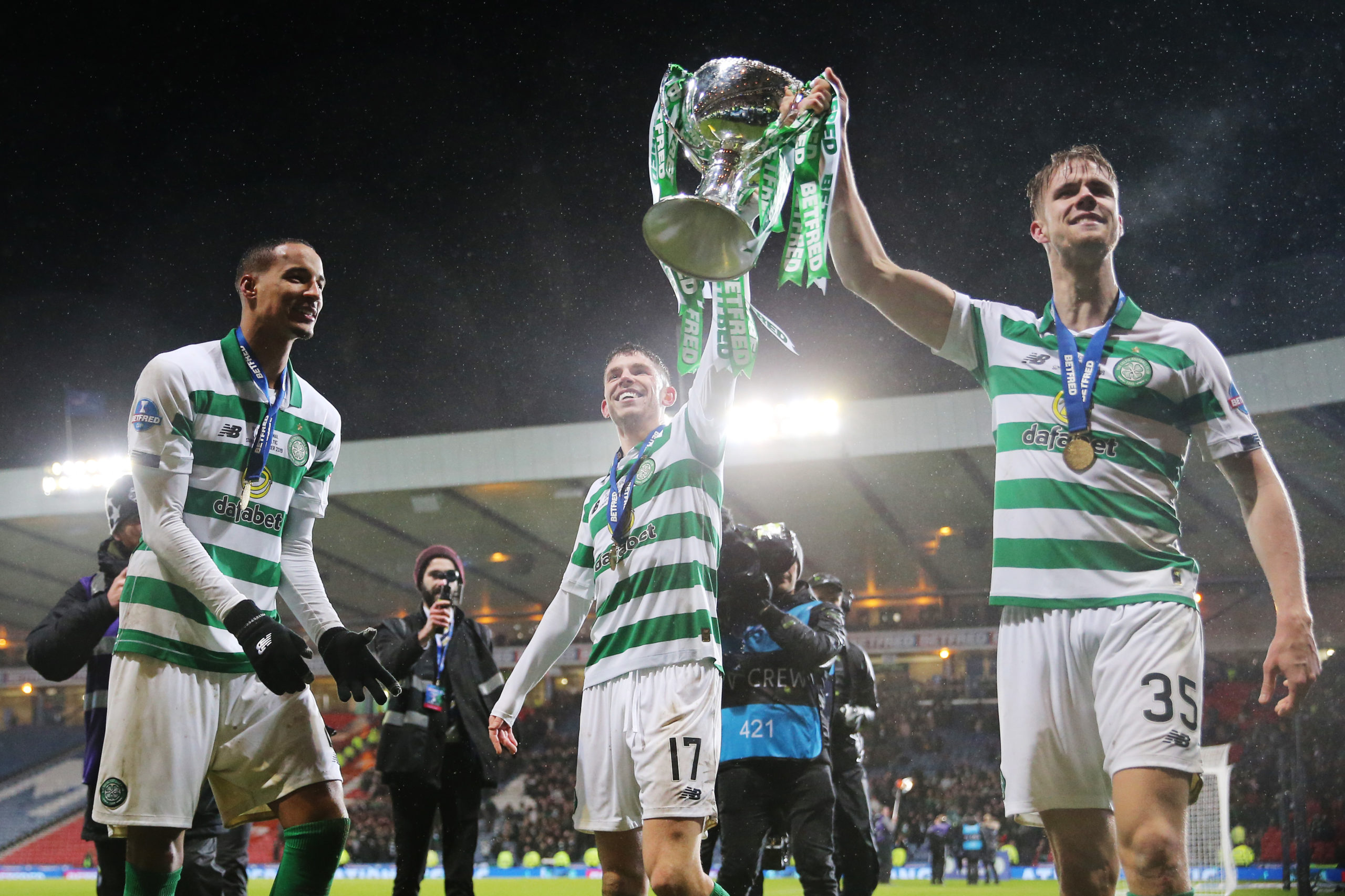 Celtic players celebrate winning the Betfred Cup