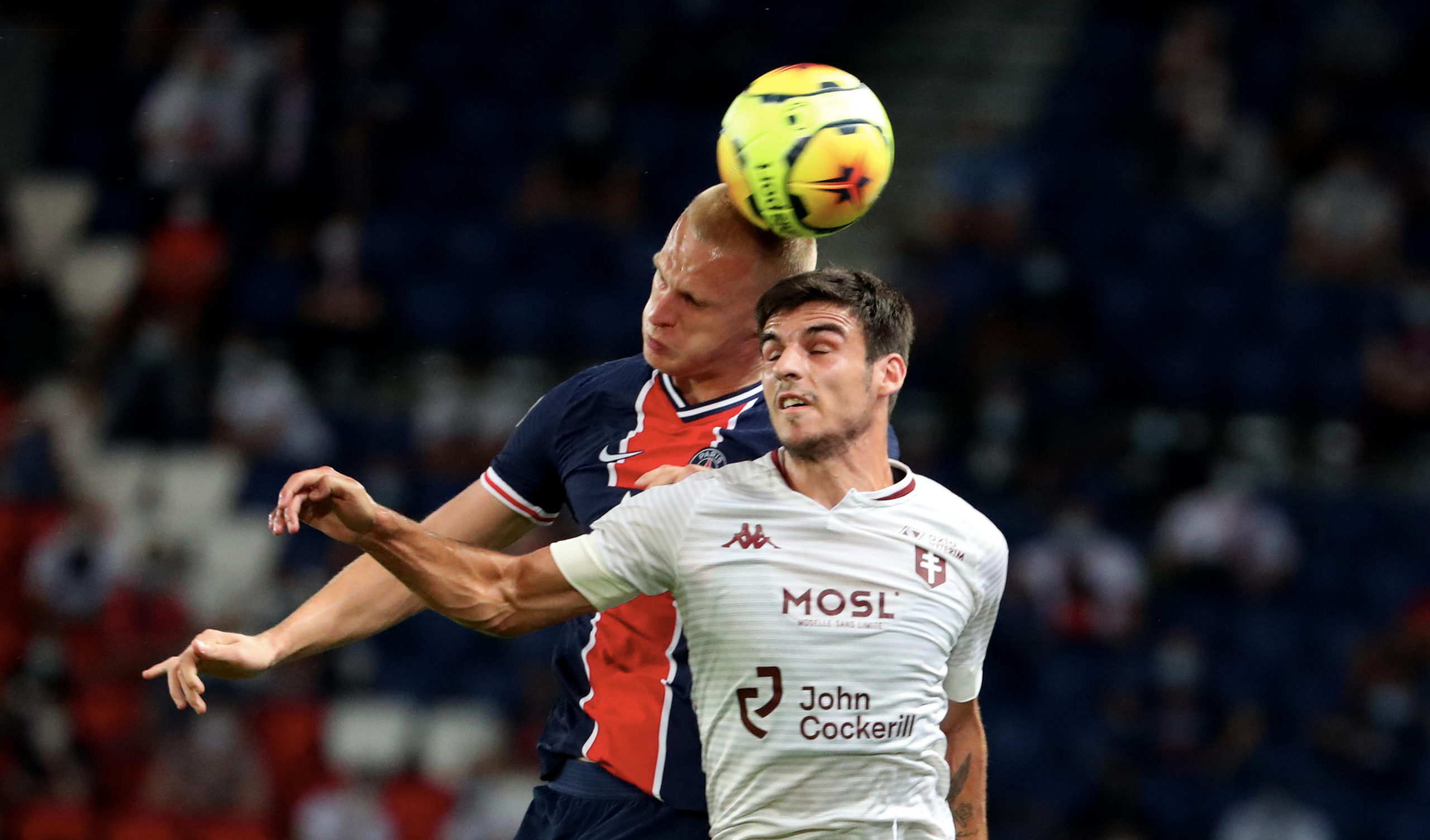 PARIS, FRANCE-SEPTEMBER 16:Mitchel Bakker of Paris Saint-Germain in action with Fabien Centonze of FC Metz with during the Ligue 1 match between Pa...