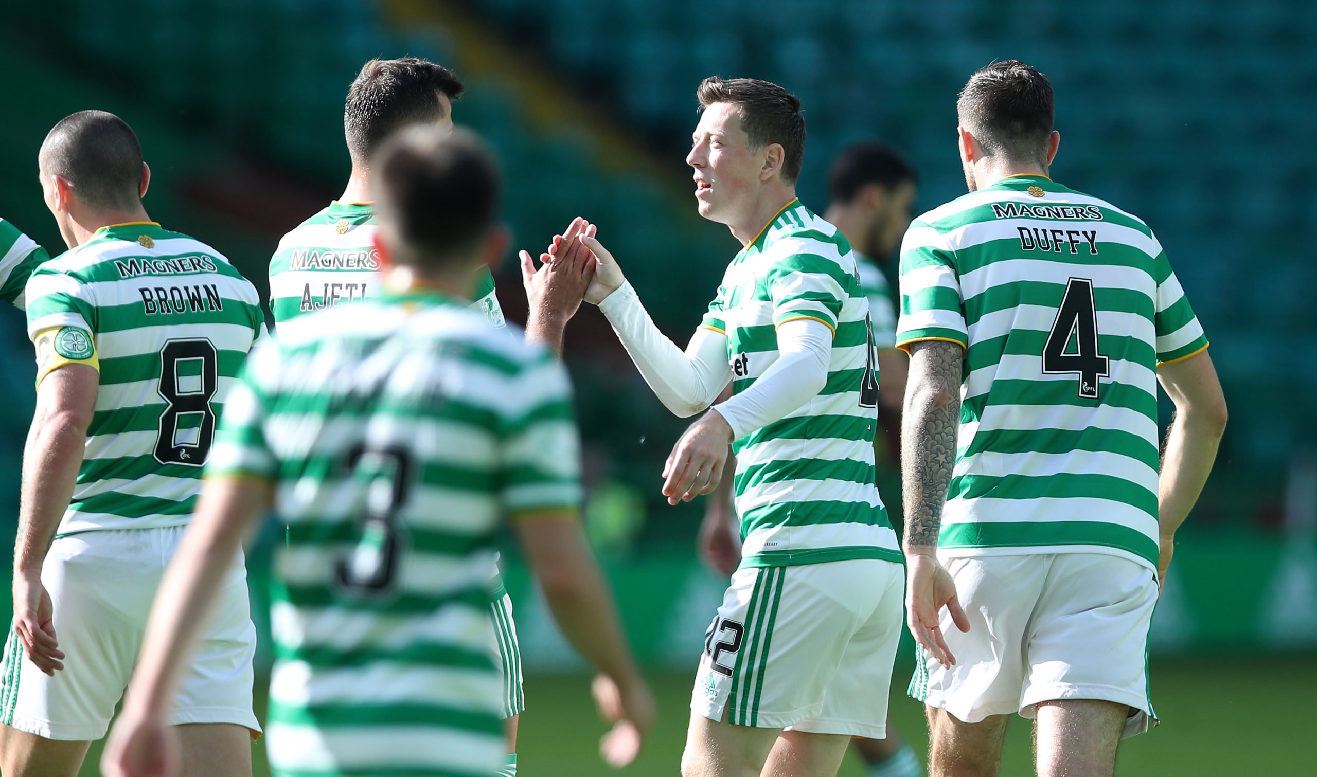 Midfielder Callum McGregor celebrates a Celtic goal