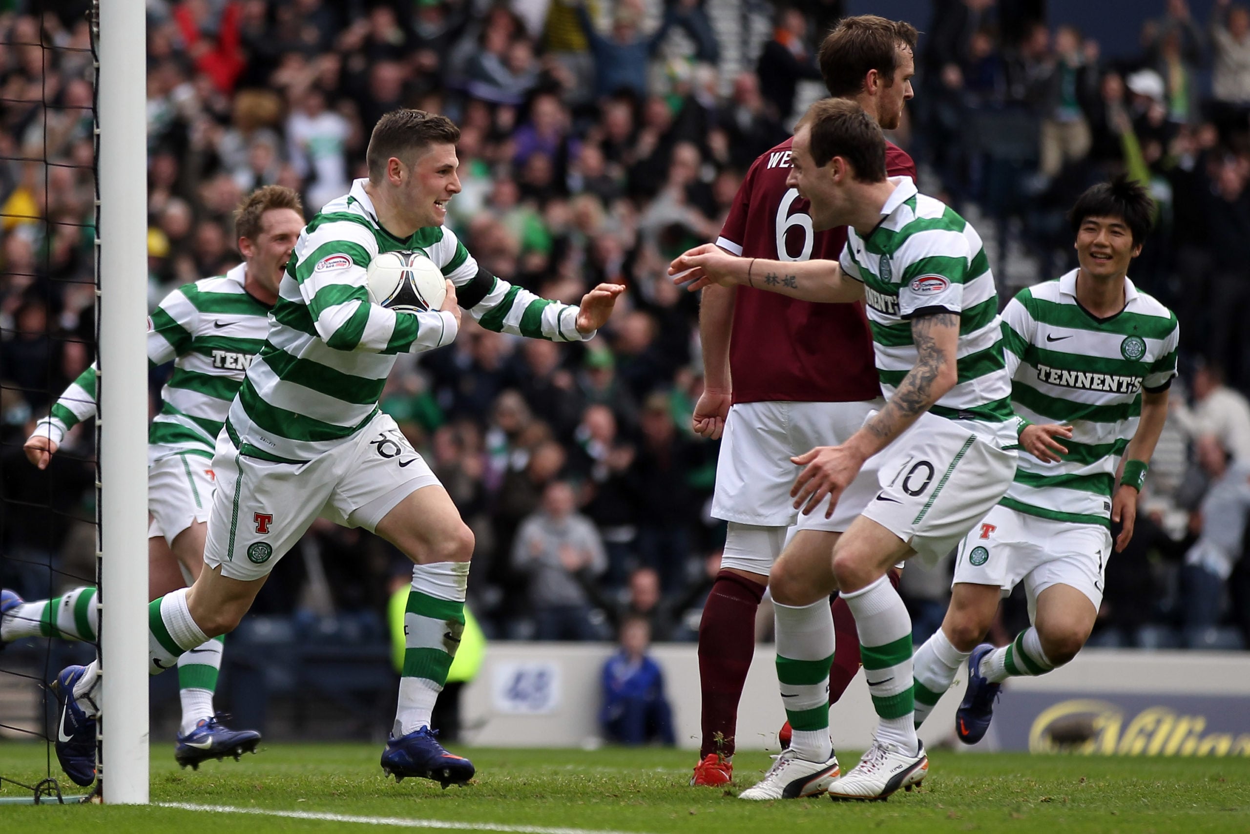 Former Celtic strike duo Anthony Stokes and Gary Hooper celebrate a goal