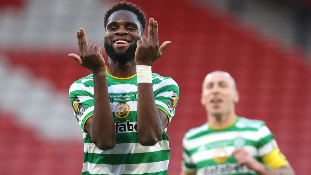 Celtic striker Odsonne Edouard celebrates with hands/fingers with Scott Brown in background