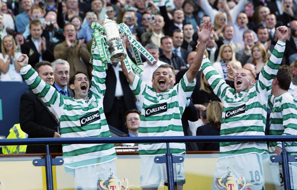 Jackie McNamara, Henrik Larsson and Neil Lennon of Celtic celebrates with the trophy after winning the 119th Scottish Tennents Cup Final between Celtic and Dunfermline held at Hampden Park