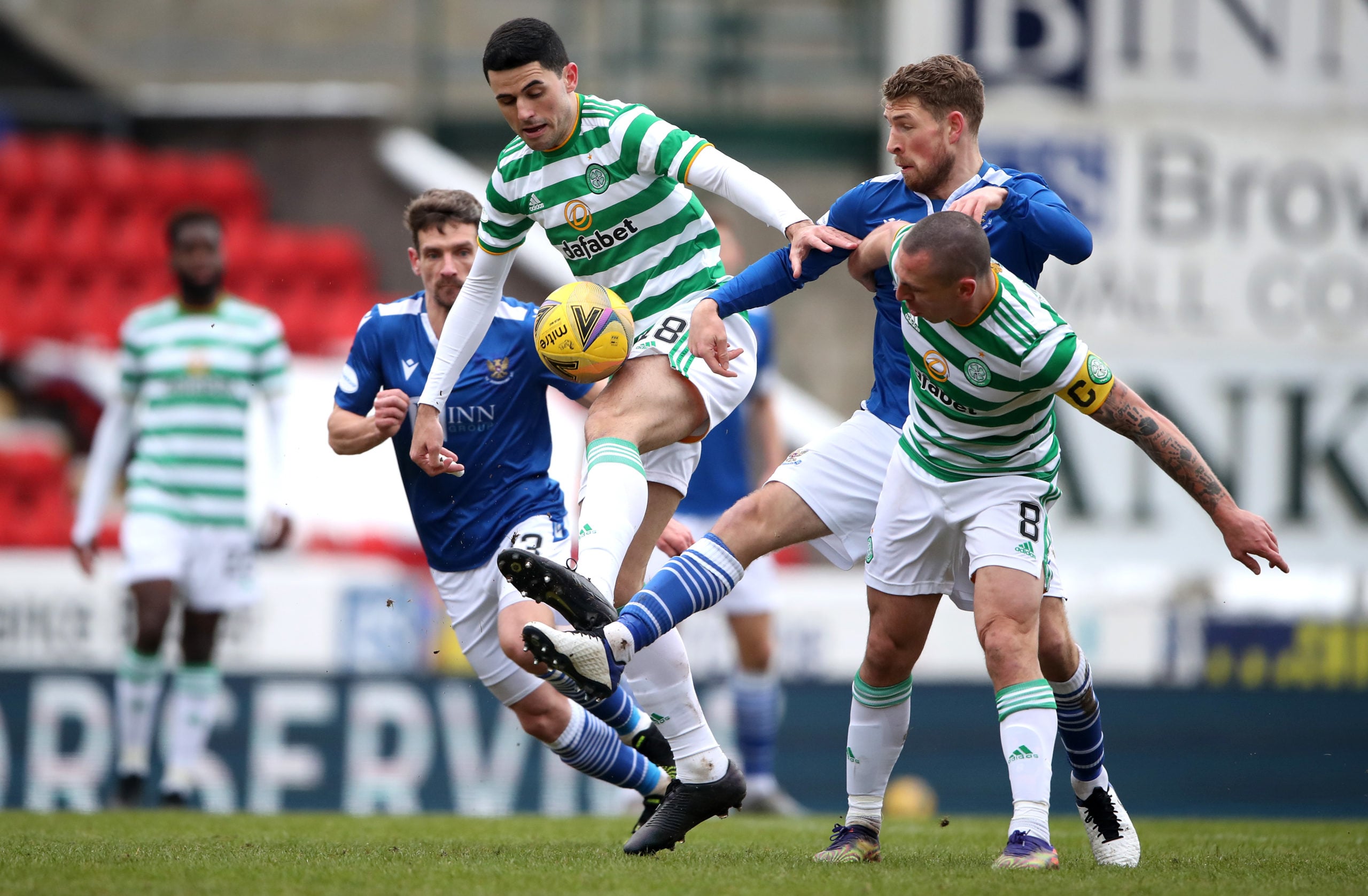 Tom Rogic and Scott Brown battle for the ball against St Johnstone