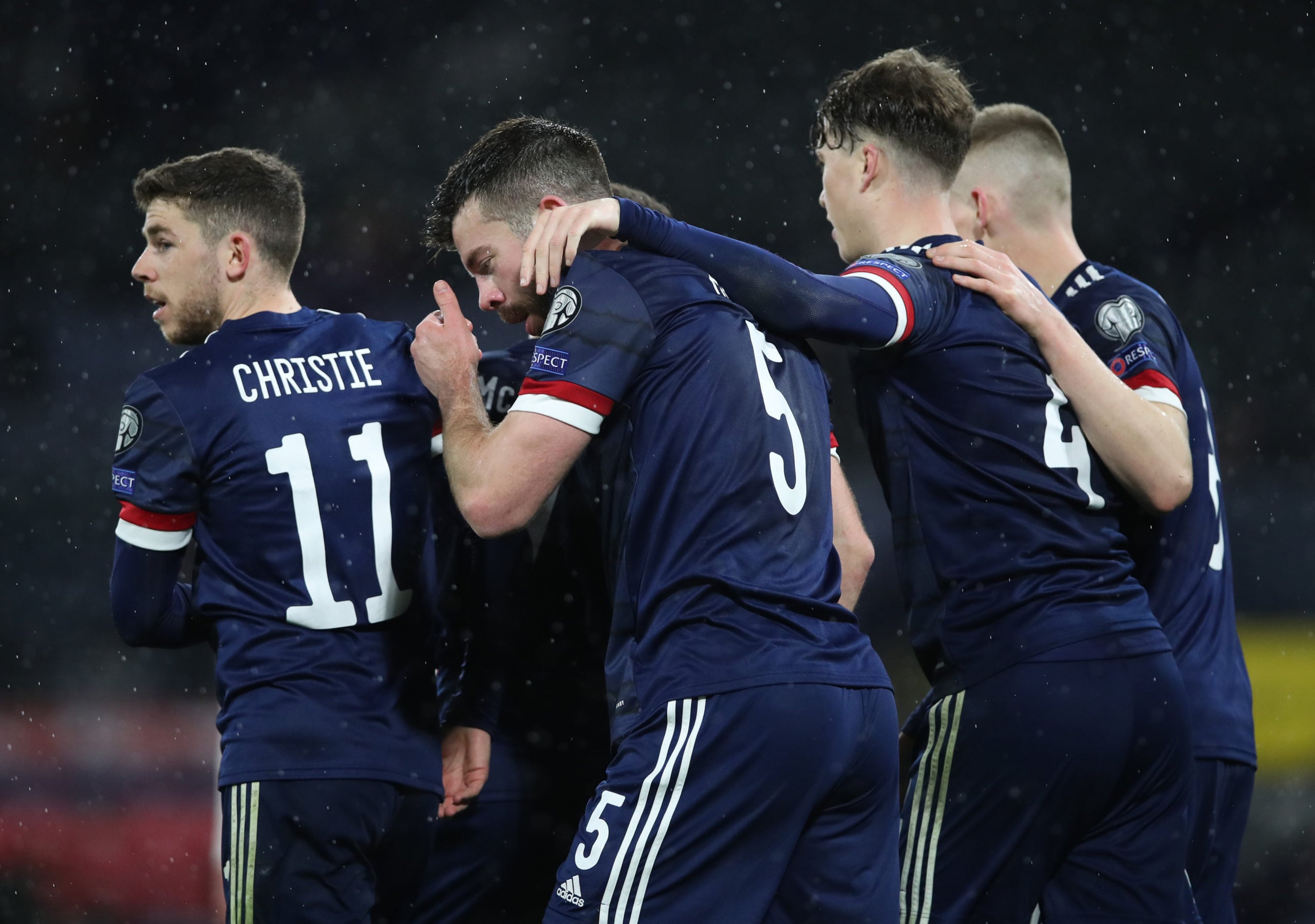 Hendry celebrates with Grant Hanley