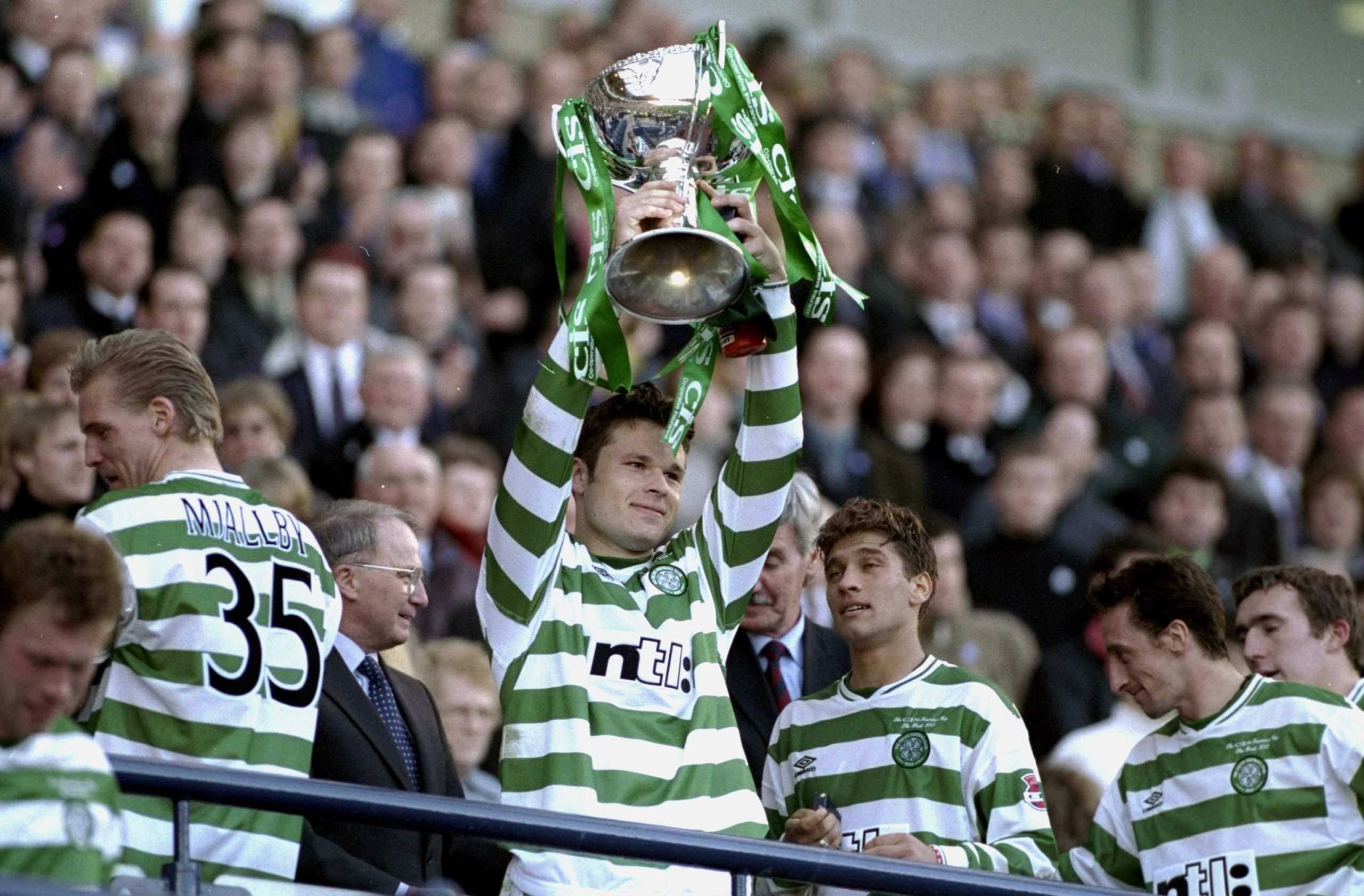 19 Mar 2000: Mark Viduka of Glasgow Celtic lifts the trophy after the CIS Insurance Cup Final against Aberdeen at Hampden Park in Glasgow, Scotlan...