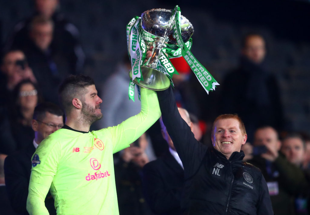 Fraser Forster of Celtic  lifts the Betfred Cup with Neil Lennon, Manager of Celtic after the Betfred Cup Final between Rangers FC and Celtic FC at...