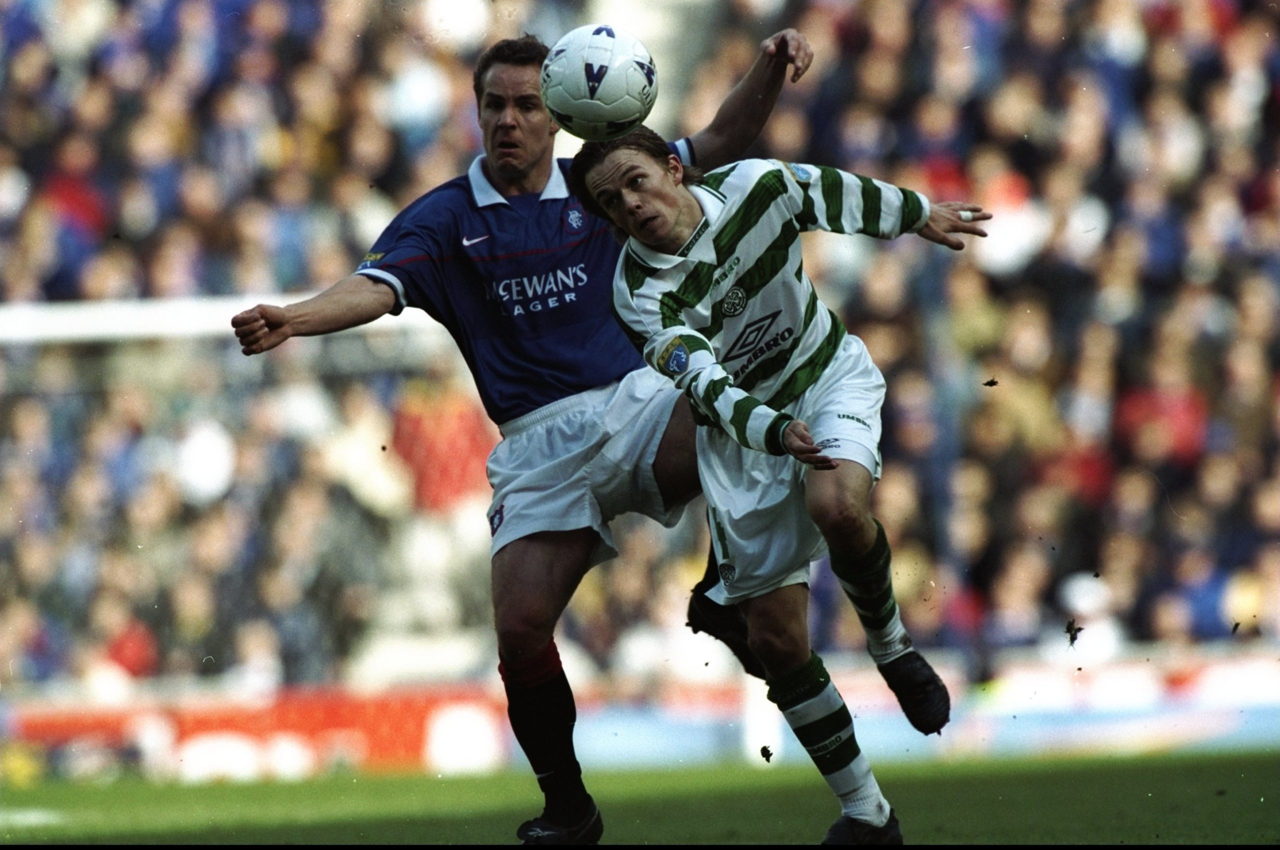 12 Apr 1998: Simon Donnelly of Celtic takes on Rangers player Jonas Thern during the match between Glasgow Rangers v Celtic in the Bells Scottish ...