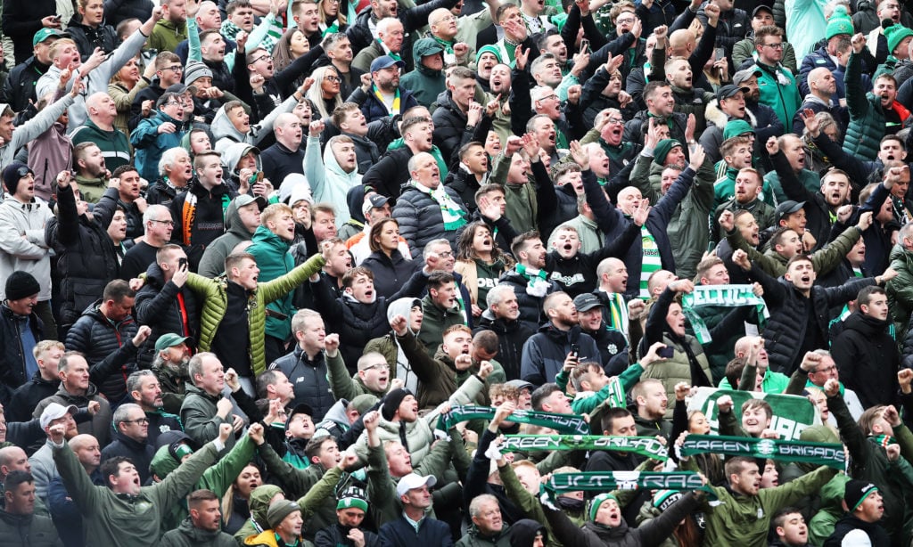 The Celtic fans celebrate at Pittodrie