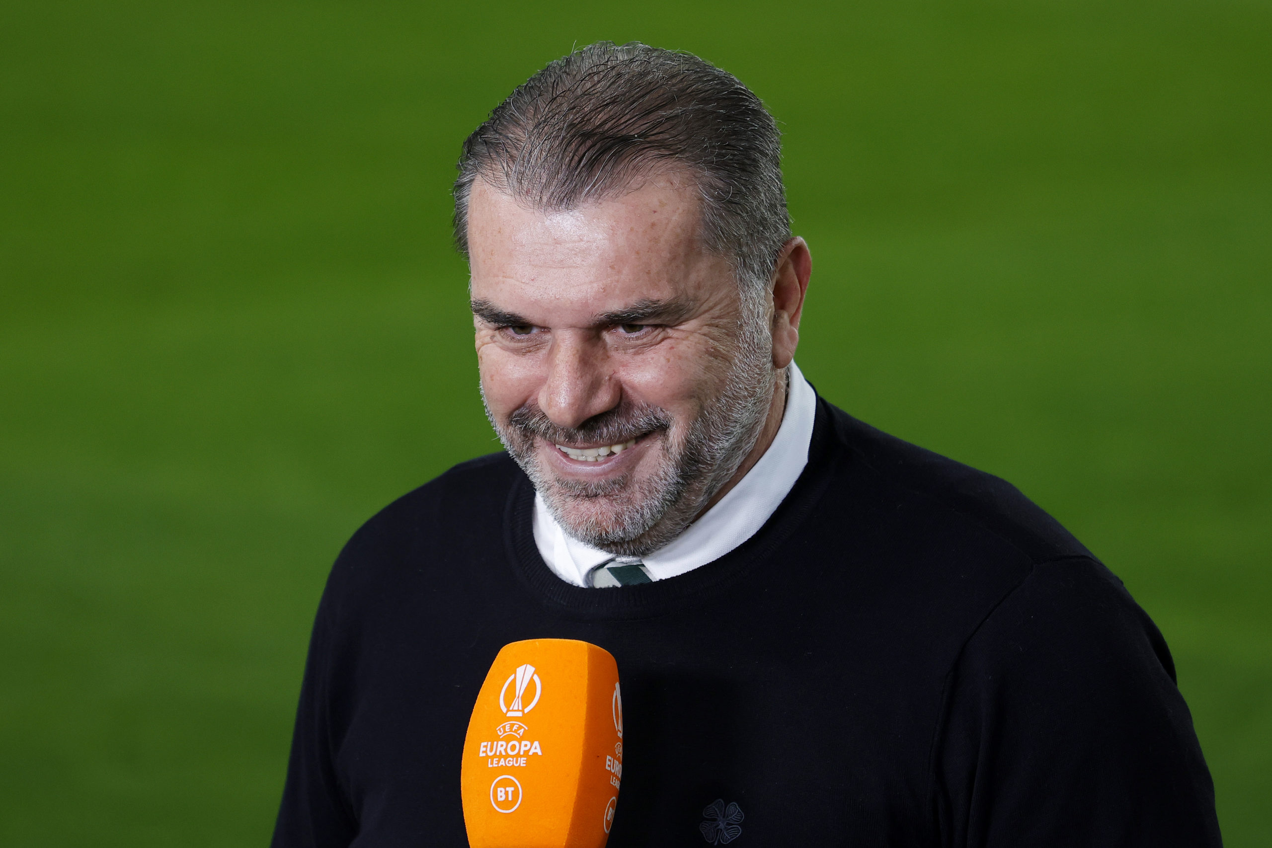 Ange Postecoglou reacts to his new song during Celtic TV interview