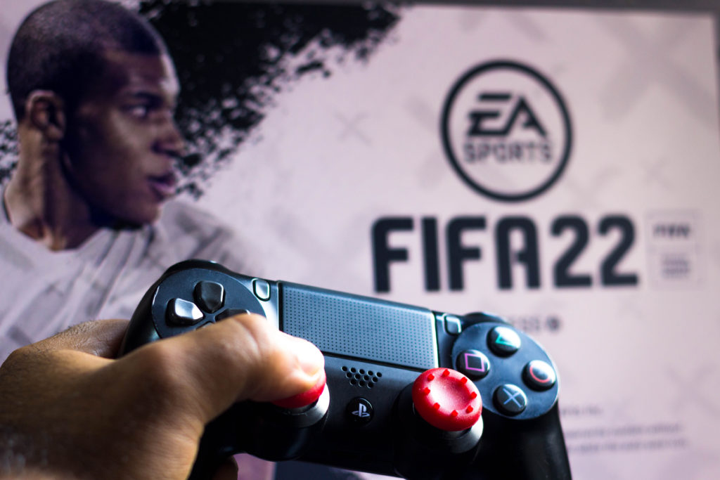 In this photo illustration, a PlayStation (PS) controller
