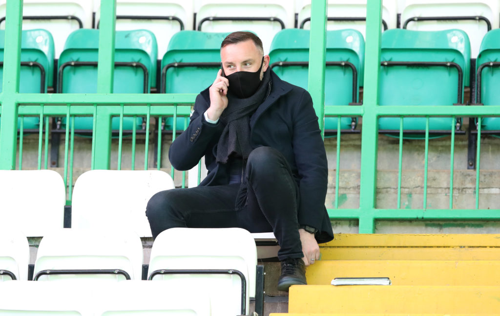 Kris Boyd sits in the stands at Celtic Park during coverage of Celtic vs Rangers