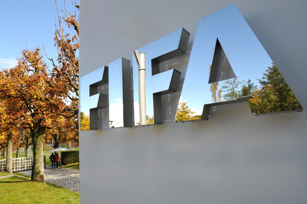 The FIFA logo is seen outside the FIFA headquarters in Switzerland.