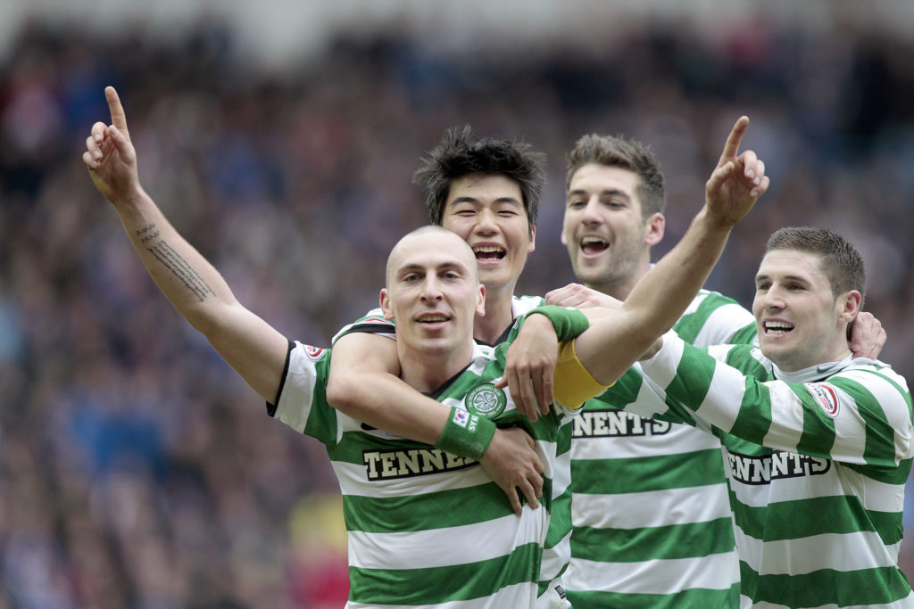Celtic's Scott Brown (L) celebrates scor