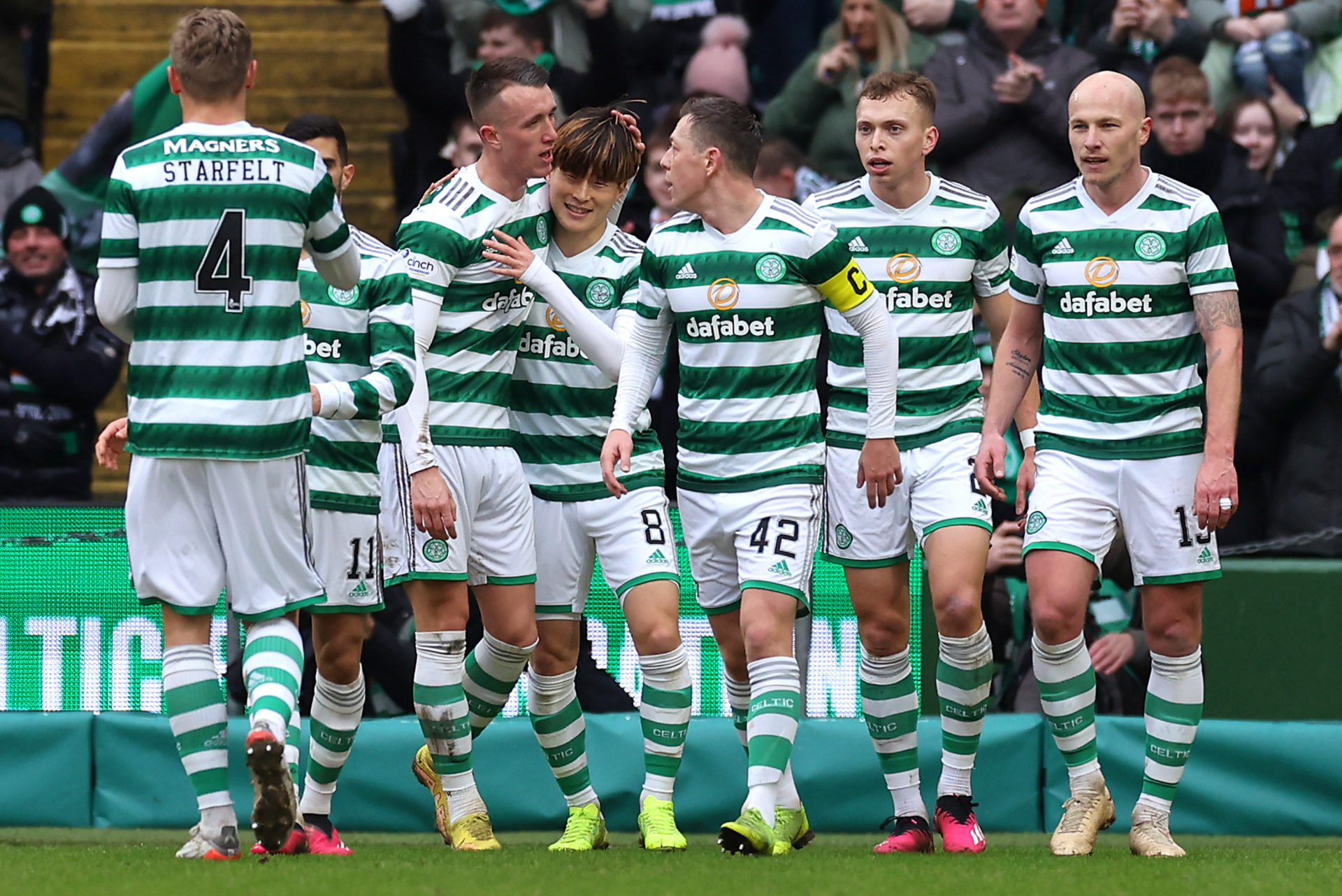 The Celtic players celebrate a goal against Greenock Morton