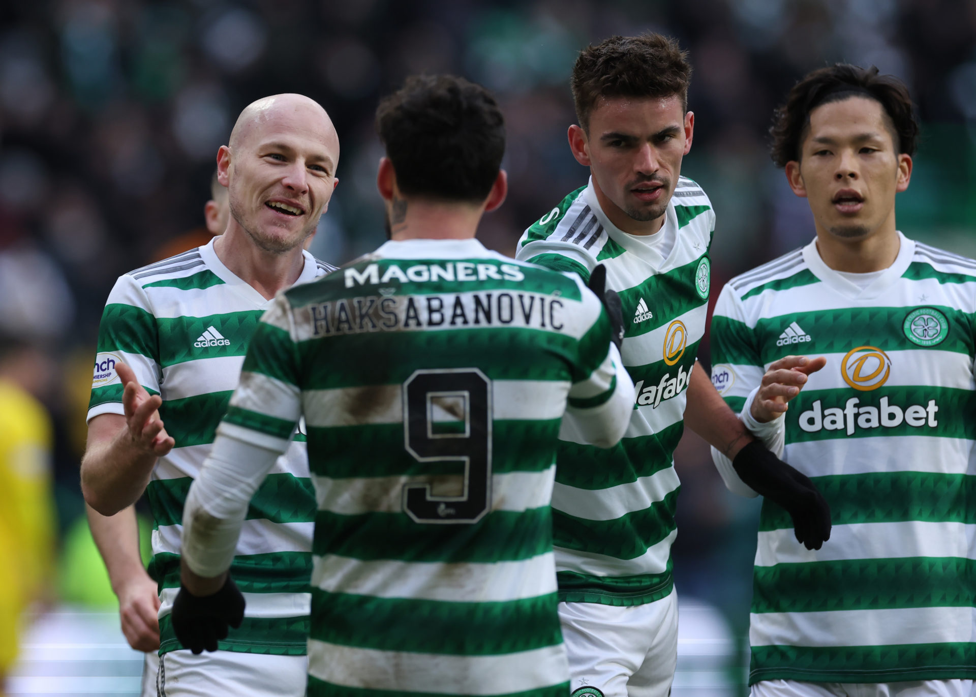 Celtic players celebrate a goal against Greenock Morton