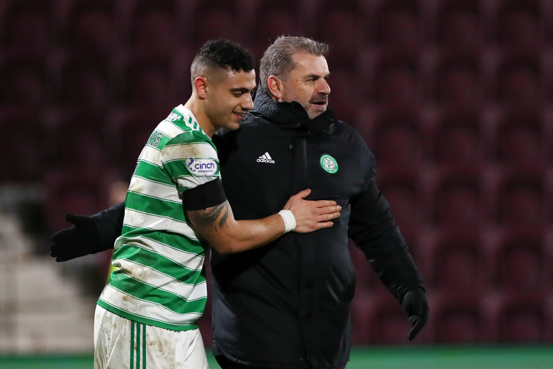 Giakoumakis and Postecoglou embrace at Tynecastle