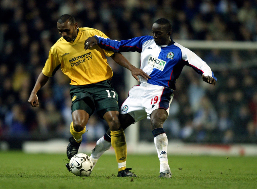 Didier Agathe of Celtic and Dwight Yorke of Blackburn Rovers