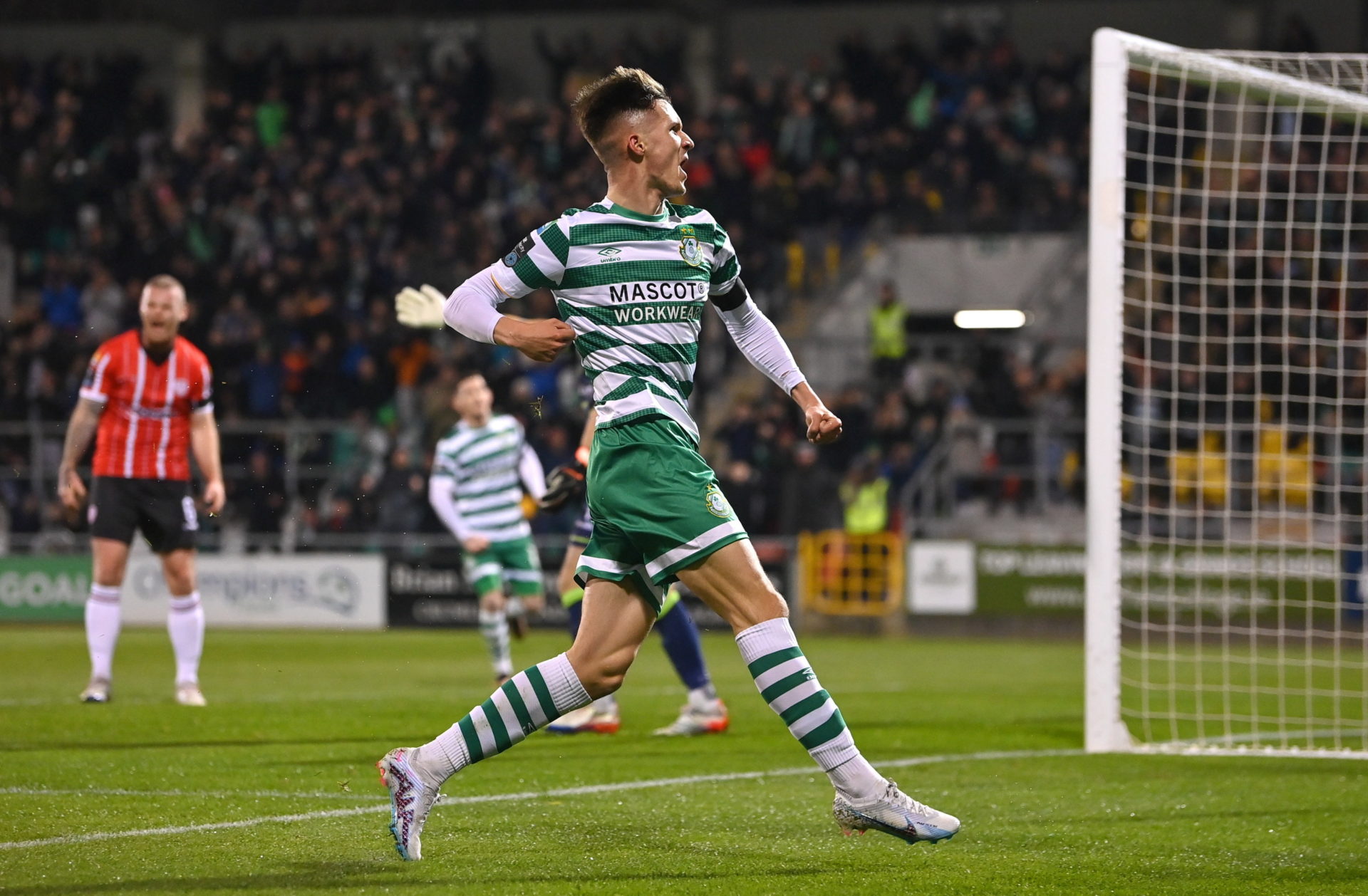 Kenny celebrates a goal against Derry City