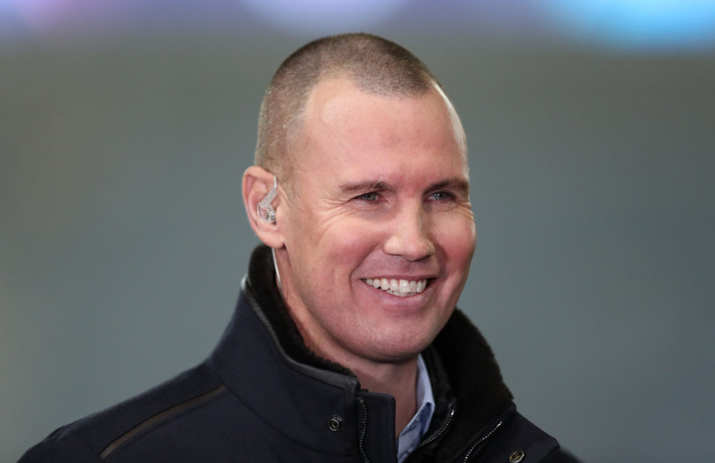 Kenny Miller, a former player of Rangers FC, smiles during a TV interview prior to the UEFA Champions League Group A match between Rangers FC and Liverpool FC at Ibrox Stadium