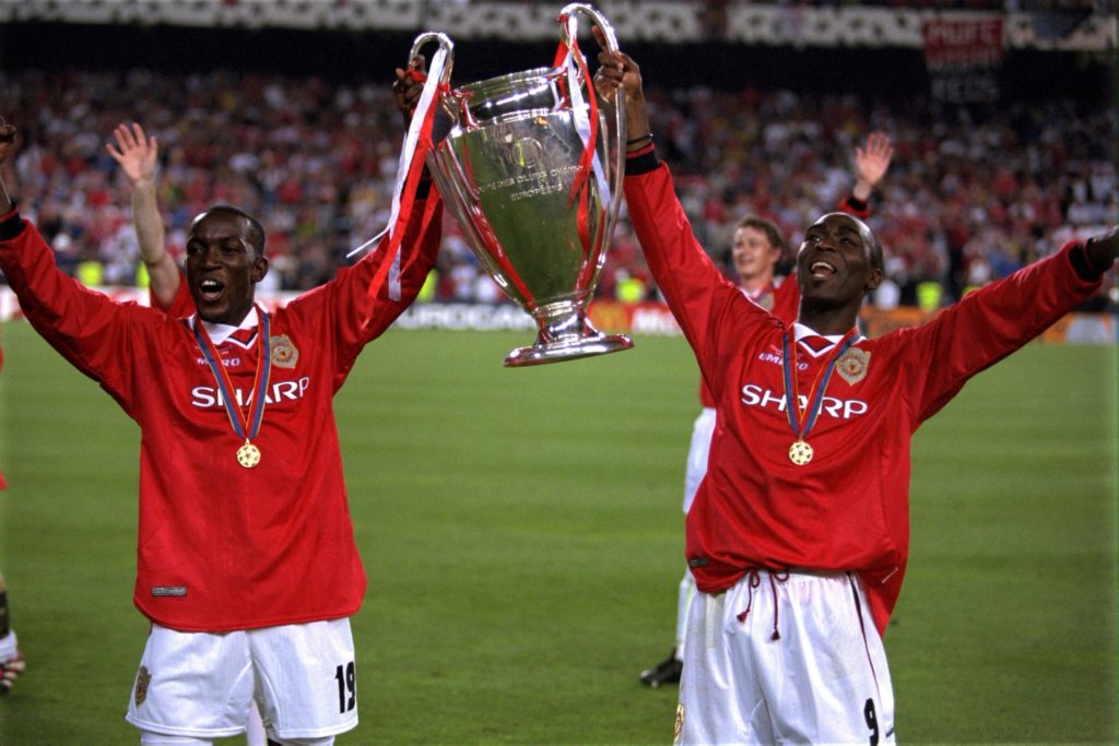 Dwight Yorke and Andy Cole of Manchester United lift the European Cup after the UEFA Champions League Final between Bayern Munich v Manchester Unit...