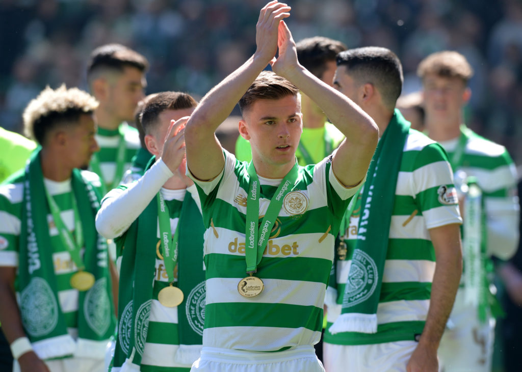 Kieran Tierney applauds the Celtic fans after lifting the Scottish Premiership title