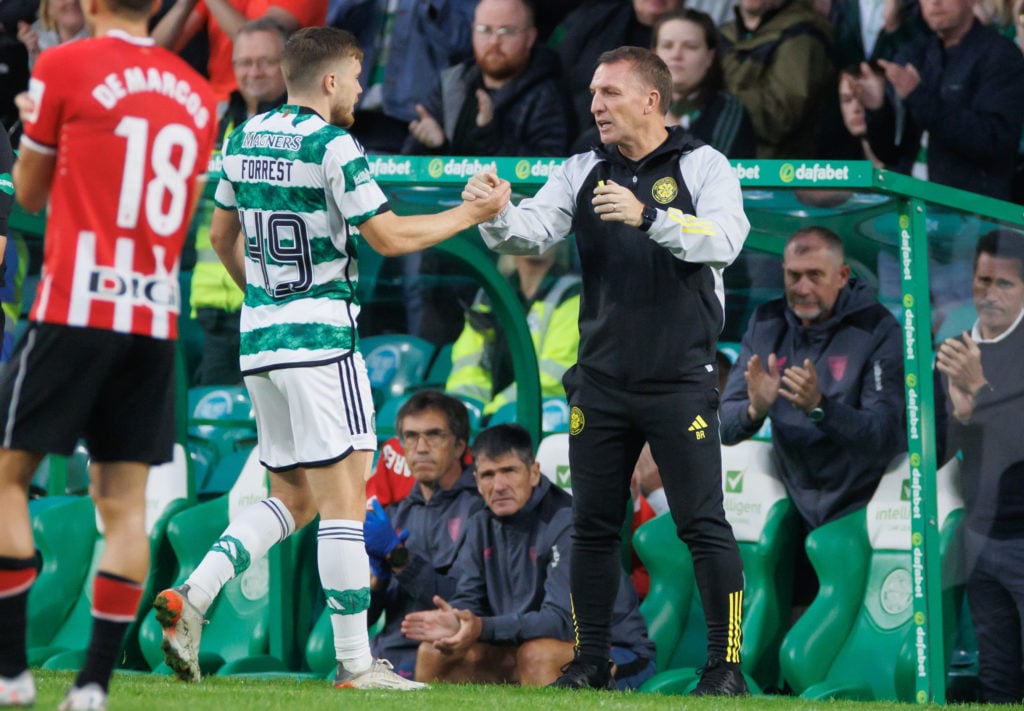 James Forrest of Celtic comes off and shakes the hand of the Celtic manager Brendan Rodgers  during the pre-season friendly match between Celtic an...