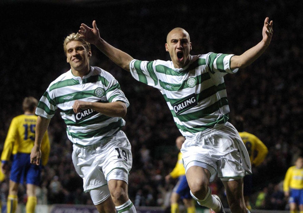Celtic's Henrik Larsson (r) celebrates w