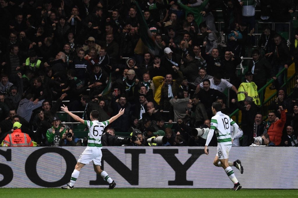Celtic's Scottish defender Kieran Tierney (L) celebrates scoring his team's second goal from a deflection by Manchester City's English midfielder R...