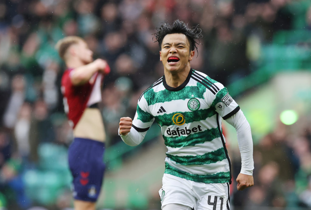Reo Hatate of Celtic celebrates after he scores his team's opening goal during the Cinch Scottish Premiership match between Celtic FC and Kilmarnoc...