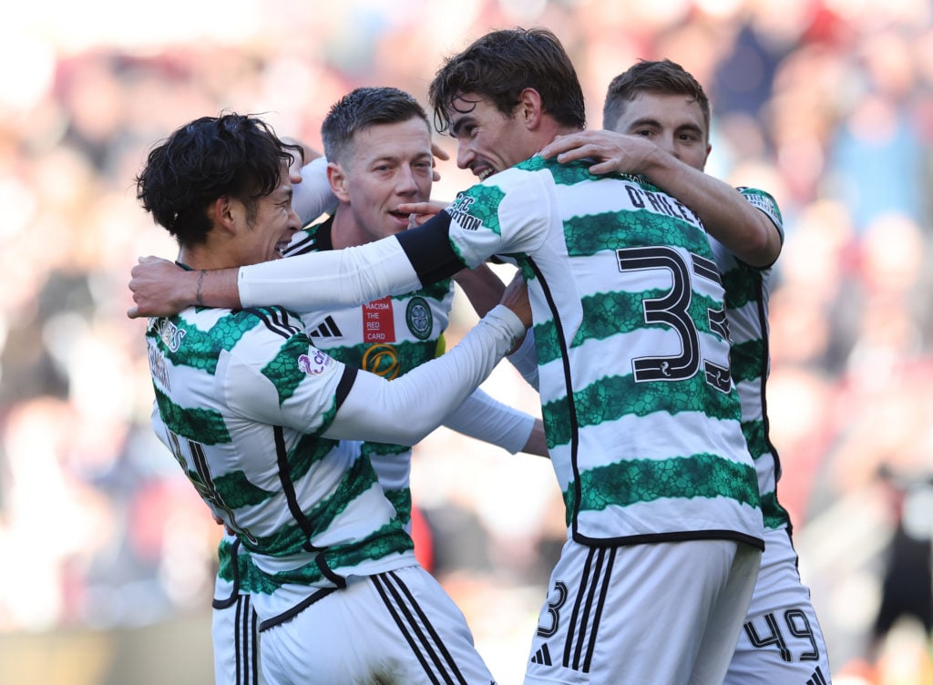 Tomoki Iwata of Celtic celebrates with team mates after scoring his team's fourth goal during the Cinch Scottish Premiership match between Heart of...