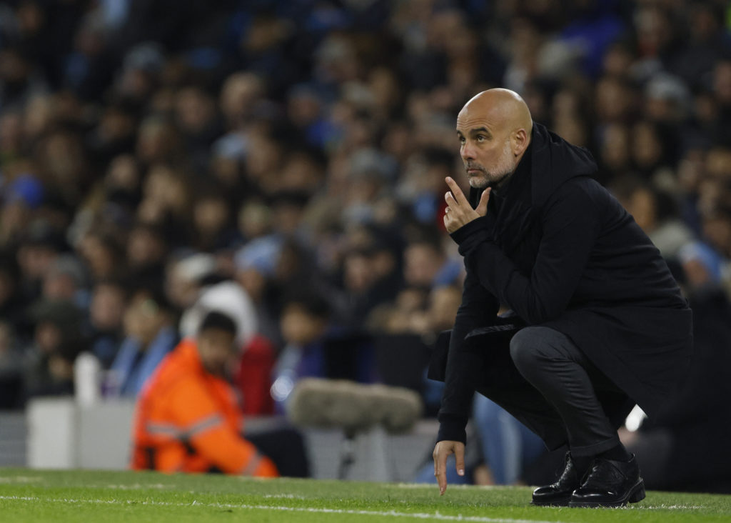 Pep Guardiola watching on during Manchester City's Champions League clash against RB Leipzig.