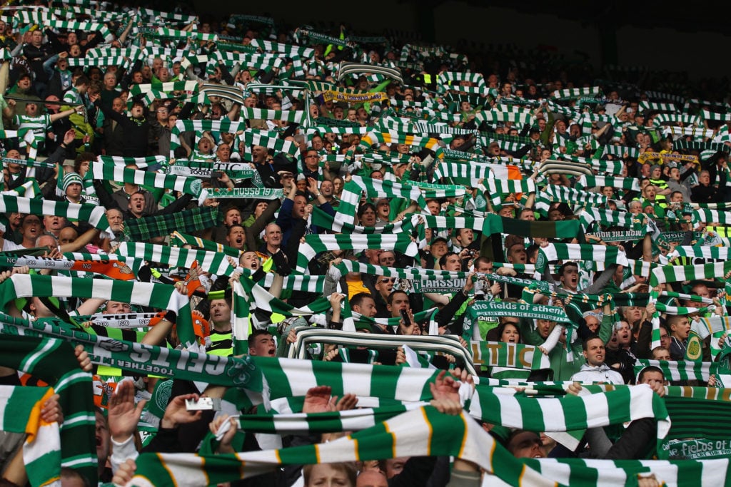 Celtic fans sing during the Clydesdale Bank Premier League match between Celtic and Rangers at Celtic Park on October 24, 2010 in Glasgow, Scotland.