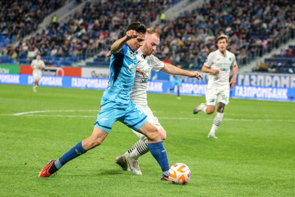 Gustavo Mantuan (31) of Zenit and Miroslav Bogosavac (8) of...