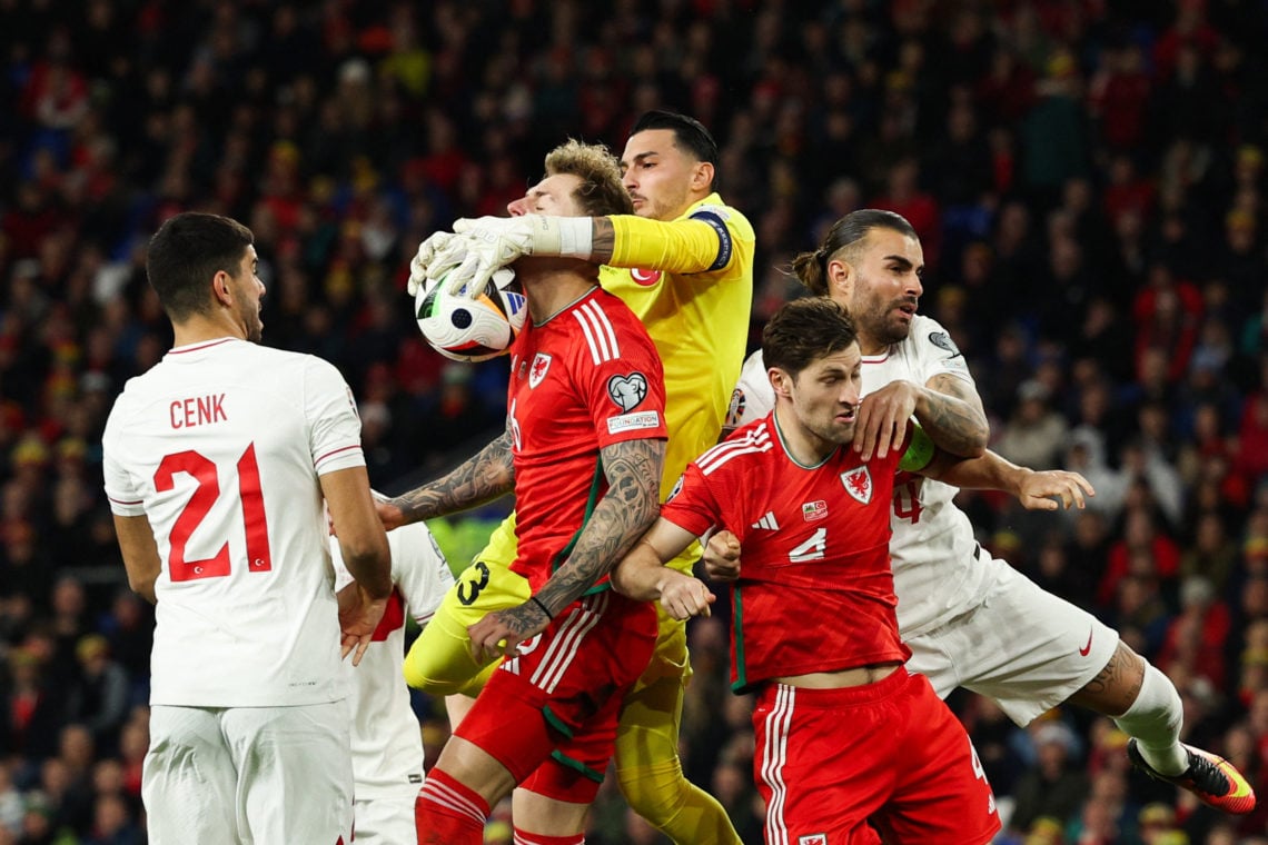 Turkey's goalkeeper #23 Ugurcan Cakir (C-R) catches the ball during the UEFA Euro 2024 Group D qualifying football match between Wales and Turkey, ...