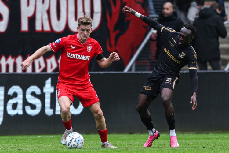 Gijs Smal of FC Twente, Bobby Adekanye of Go Ahead Eagles battle for the ball during the Dutch Eredivisie match between FC Twente and Go Ahead Eagl...