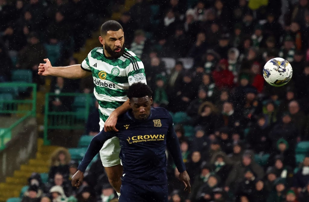 Cameron Carter-Vickers scores his team's opening goal during the Cinch Scottish Premiership match between Celtic FC and Dundee FC at Celtic Park St...