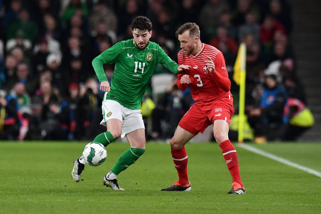 Mikey Johnston of Republic of Ireland challenges for the ball with Silvan Widmer of Switzerland during the international friendly match between Rep...