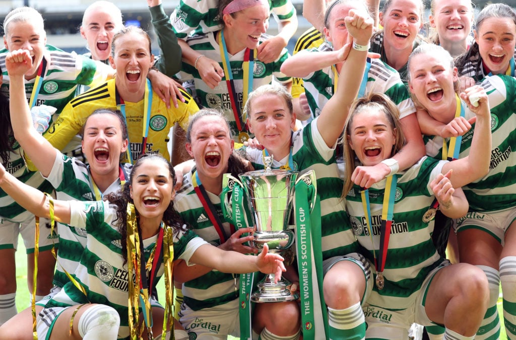 Celtic players celebrate as Kelly Clark lifts the trophy during the Women's Scottish Cup Final between Celtic and Rangers at Hampden Park on May 28...