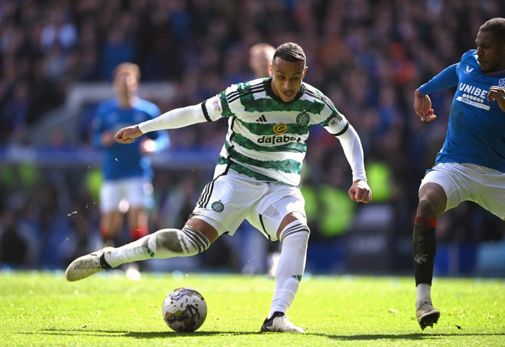 Celtic player Adam Idah shoots to score the third Celtic goal during the Cinch Scottish Premiership match between Rangers FC and Celtic FC at Ibrox...